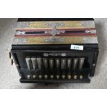 A vintage melodeon, marked Empress, Pammont & Smith