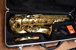A Gear 4 Music alto saxophone AS-100G with unbranded mouthpiece and fitted case, serial number