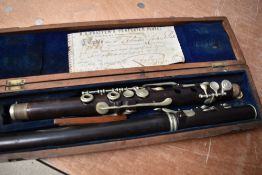 A 19th Century rosewood flute, Boosey and Co , Pratten's perfected , with fitted and labelled