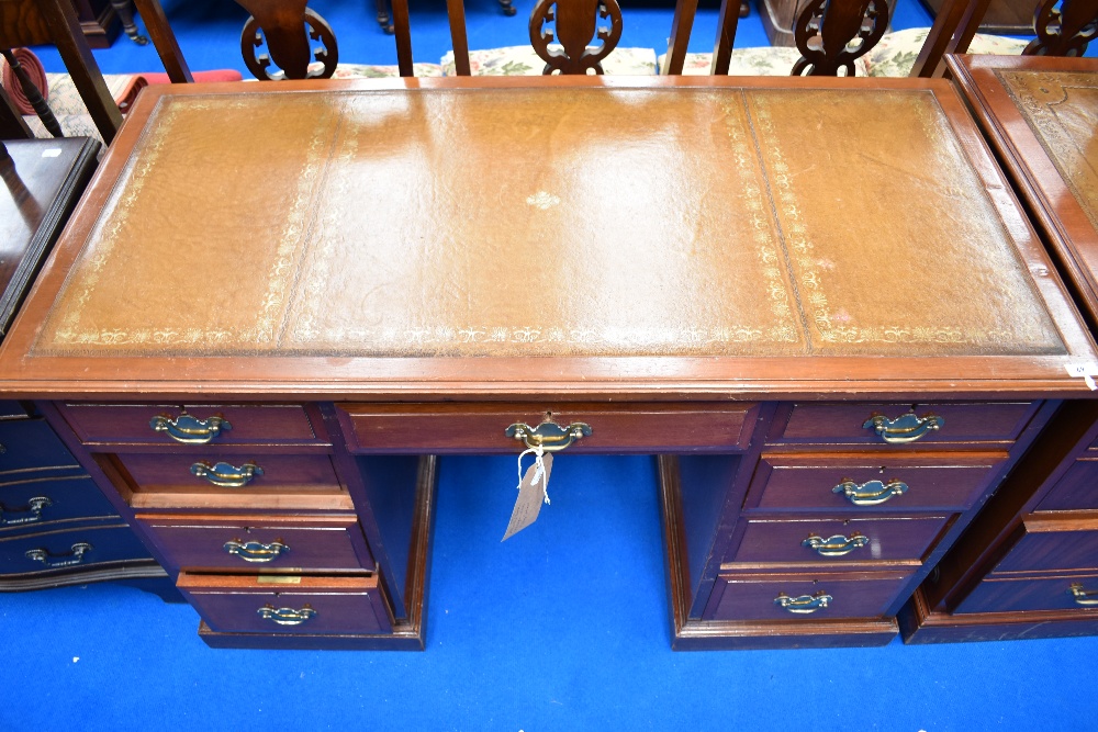 A Victorian mahogany pedestal desk having later skiver top