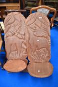 A traditional African Palaver chair having carved elephant decoration together with a further