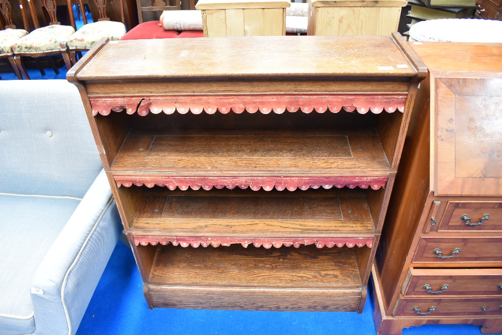 A 19th Century oak bookshelf , three tier, label to reverse for W Baker & Co