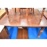 A Victorian oak wind out dining table, approx 138 x 122cm closed dimensions, with winder and