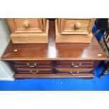 A modern hardwood coffee table with drawers