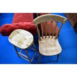 A modern turned wood bar stool and traditional kitchen chair