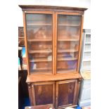 A19th Century mahogany bookcase having glazed top with double cupboard base