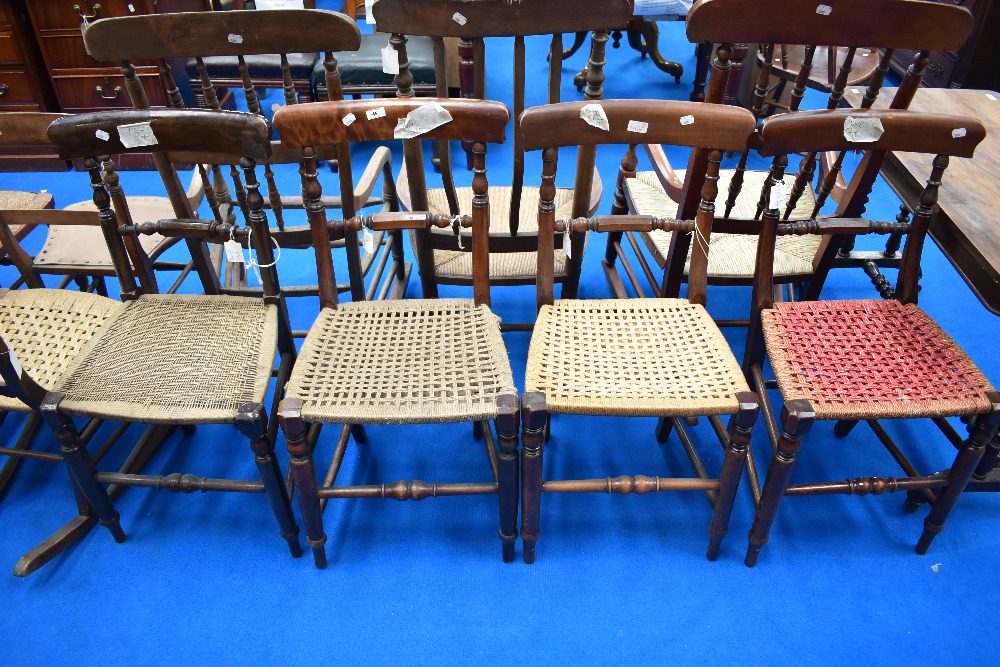 A harlequin set of four railback dining chairs, believed to be of local interest