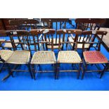 A harlequin set of four railback dining chairs, believed to be of local interest