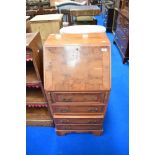 A reproduction yew wood dwarf bureau