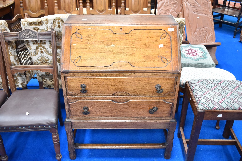 An early to mid 20th Century oak bureau