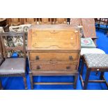 An early to mid 20th Century oak bureau