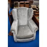 A modern silver grey upholstered armchair (DFS)