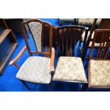 A set of three early 20th Century mahogany dining chairs , plus one similar and a later carver