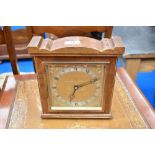 A vintage mahogany cased mantel clock having brass dial named for Elliott