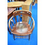 A Victorian oak spindle back tub chair