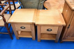 A pair of modern oak bedside tables