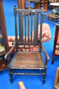 A 19th Century oak carver chair having rail back and solid seat, width approx 62cm