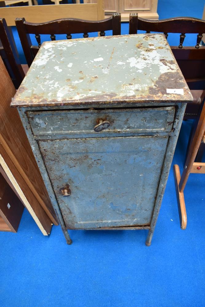 A vintage metal side cabinet