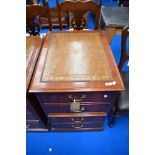 A reproduction two drawer filing cabinet