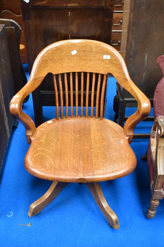 An early 20th Century oak swivel office chair