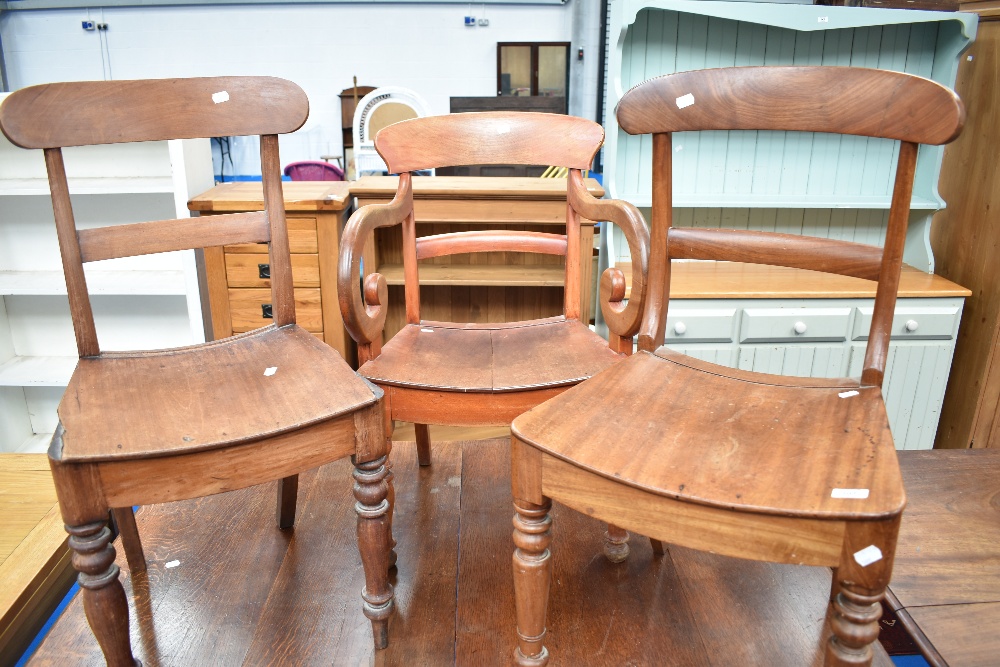 Three (two plus one) Victorian solid seat chairs having rail backs