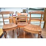 Three (two plus one) Victorian solid seat chairs having rail backs
