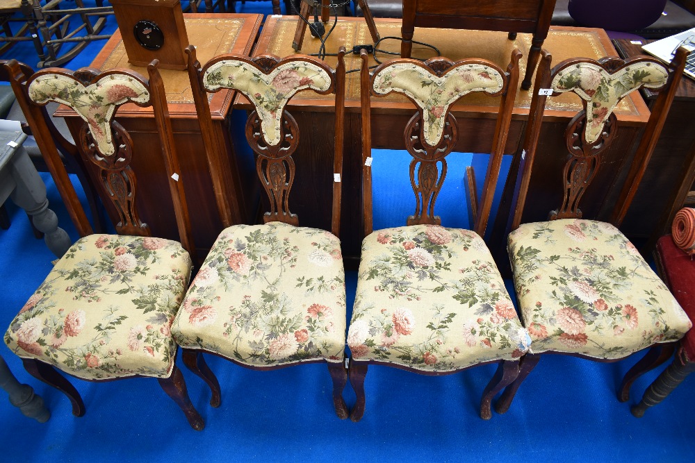 A set of four late Victorian upholstered dining chairs having mahogany frame