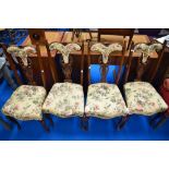 A set of four late Victorian upholstered dining chairs having mahogany frame