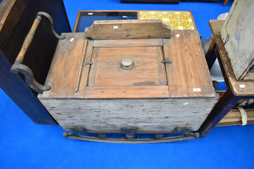 An interesting and unusual wooden rocking washing machine having cast metal rockers