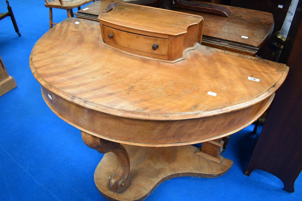 A Victorian satinwood demi lune dressing table