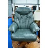 A green leather easy chair , Stressless style