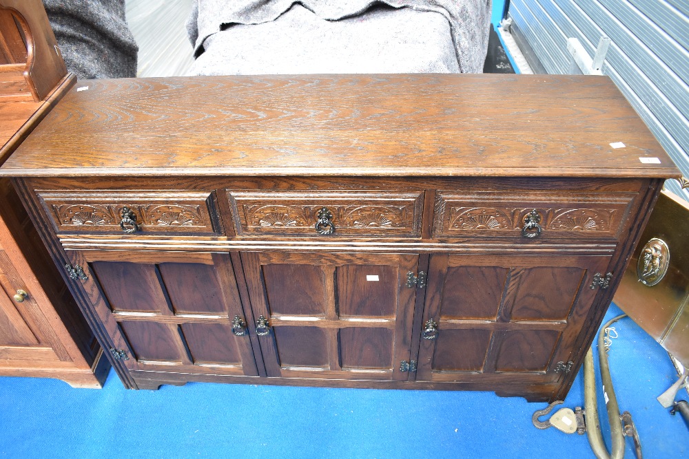 A vintage dark oak Priory style sideboard or dresser base
