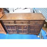 A vintage dark oak Priory style sideboard or dresser base