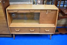 An mid 20th Century golden oak Gomme (G plan) lounge sideboard/cocktail or display