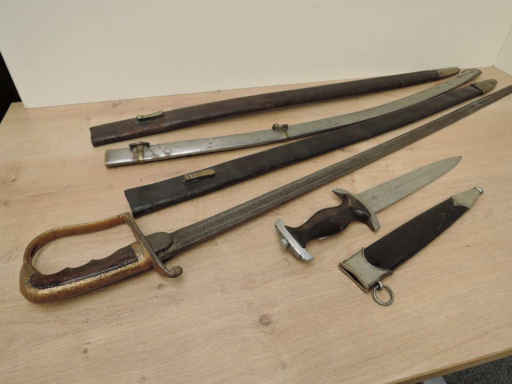 A reproduction German Dagger along with an unknown Sword in af condition, two leather scabbards - Image 2 of 7