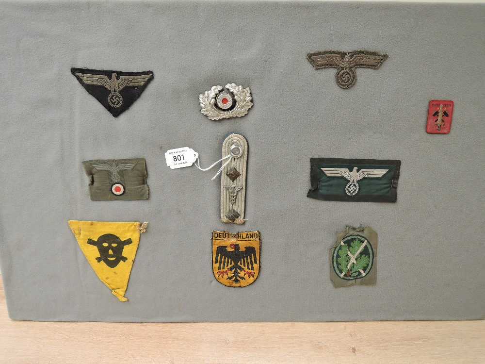 A collection of German Cloth Badges, Visor Cap Wreath, Panzer Breast Eagle, M38 Heer Officers Bevo