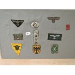 A collection of German Cloth Badges, Visor Cap Wreath, Panzer Breast Eagle, M38 Heer Officers Bevo