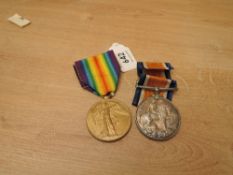 A WWI Medal Pair, War & Victory Medals to 1803 PTE.W.E.S.SHAW.DENBRGH.YOU, both with ribbons,