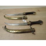 A pair of Turkish/Persian Khanjar Daggers with wood & brass hilts, decorated brass scabbards, 22cm