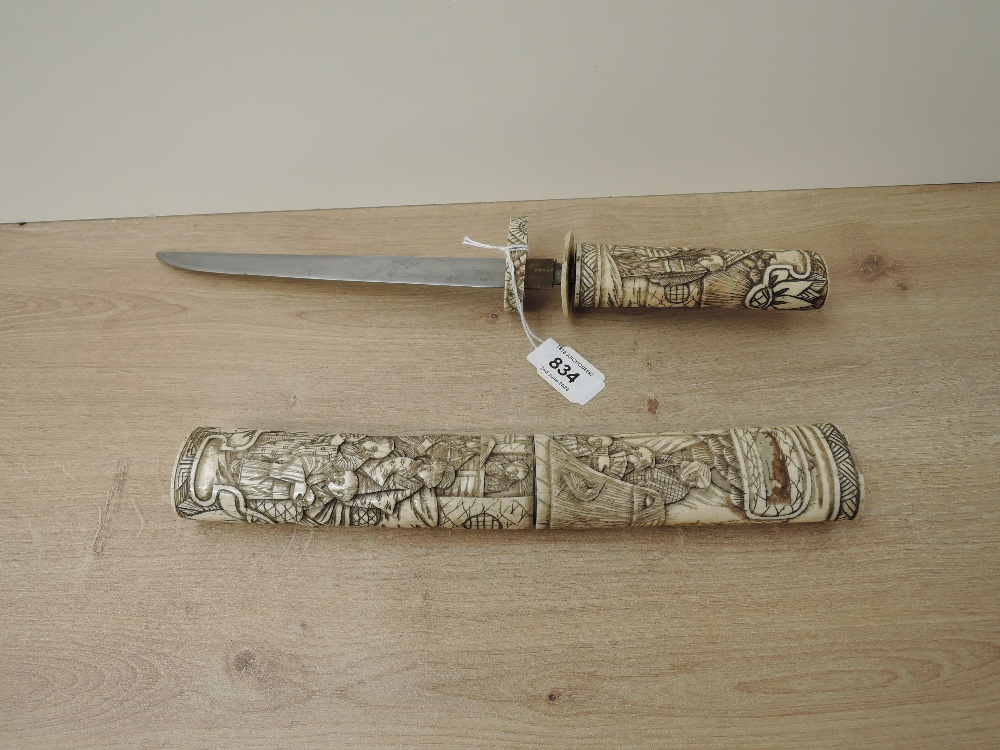 A Japanese Dagger with highly carved bone hilt and scabbard depicting Village People & Houses, blade - Image 2 of 8