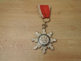 A China, Republic, Order of the Golden Grain, breast badge, in silver, silver-gilt and enamels,