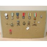 A collection of Italian Medals, Fascist Youth Badge x2, WWI Republic Long Service Cross 16 Years,