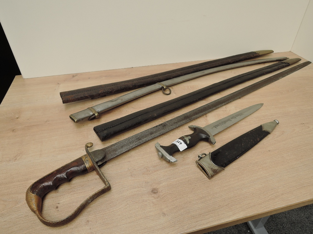 A reproduction German Dagger along with an unknown Sword in af condition, two leather scabbards