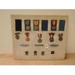 A collection of US Medals and Badges, WWII European African Middle Eastern Campaign Medal, WWII
