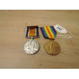 A WWI Medal Pair, War & Victory to 12489 A.W.O.CL.2.J.ROBERTS.R.W.FUS, victory medal name erased,