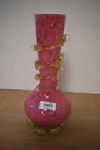 A 20th Century pink cased spangled glass vase, measuring 25cm tall