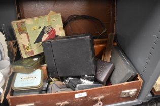A miscellaneous selection of items including advertising tins, a Kodak Box Brownie camera, an