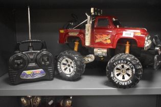 A Turbo Tec Radio Controlled Mad Bull 4x4 Off Road Truck, with controller and cables