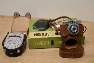 A vintage Prinzlite III exposure meter and a Mycro III A miniature camera.