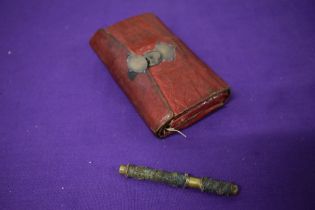 A Victorian green and red stained leather sewing case.